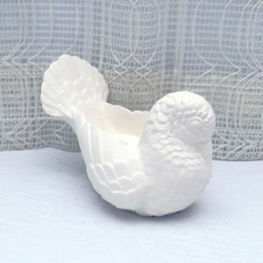 Ready to Paint ceramic bird facing at an angle toward the right.  His beak is tucked into his breast.