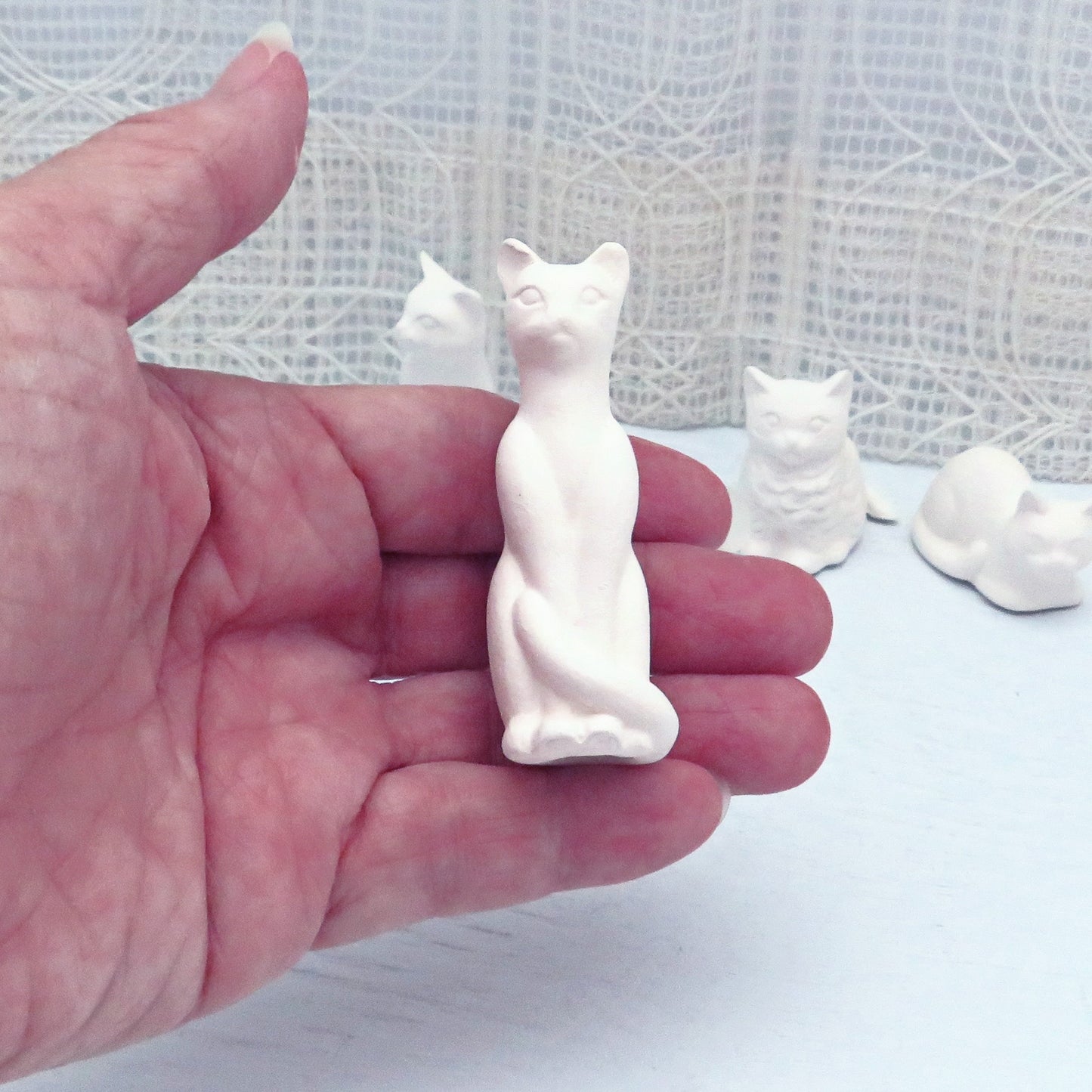 Tallest paintable ceramic cat statue in my hand