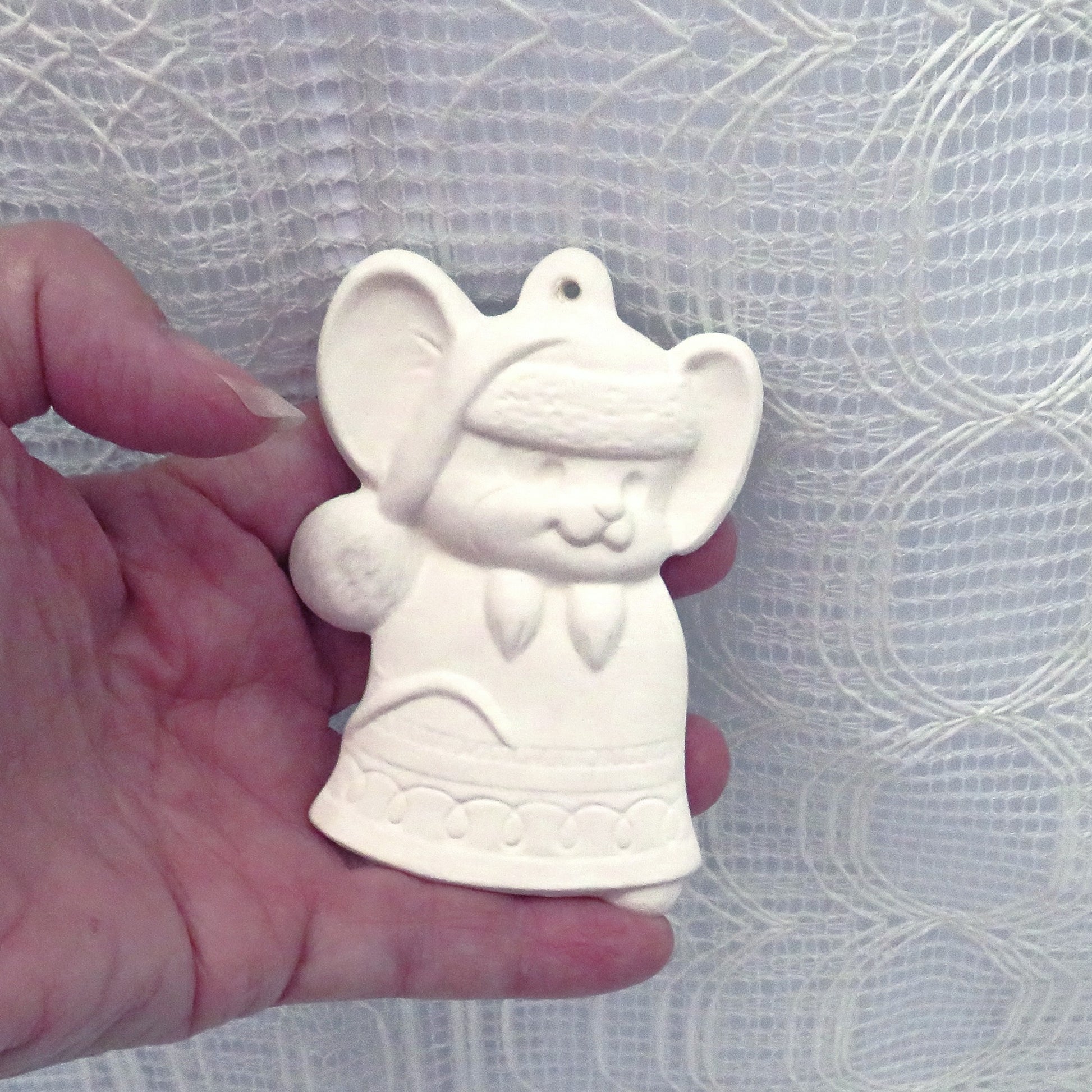 Handmade Ceramic ornament featuring mouse on a Christmas bell.