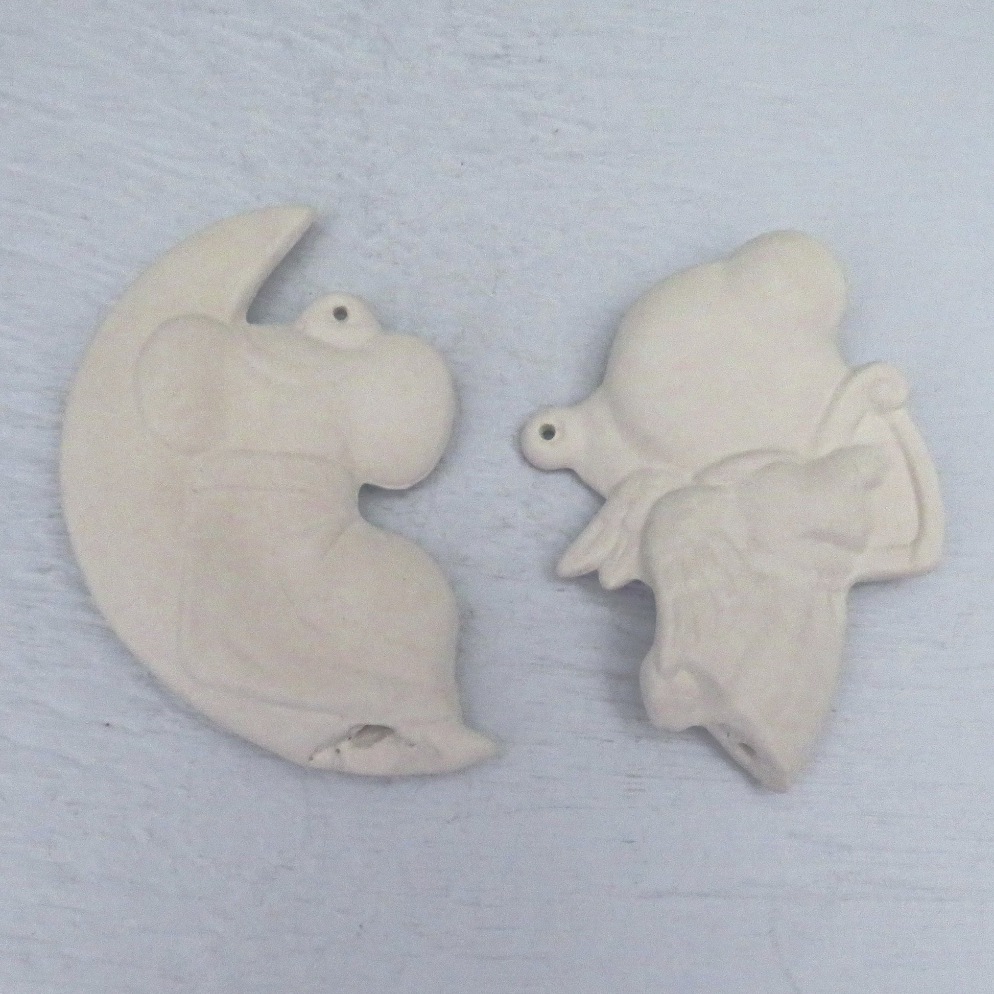 Back view of diy Christmas tree ornaments on a pale blue background.