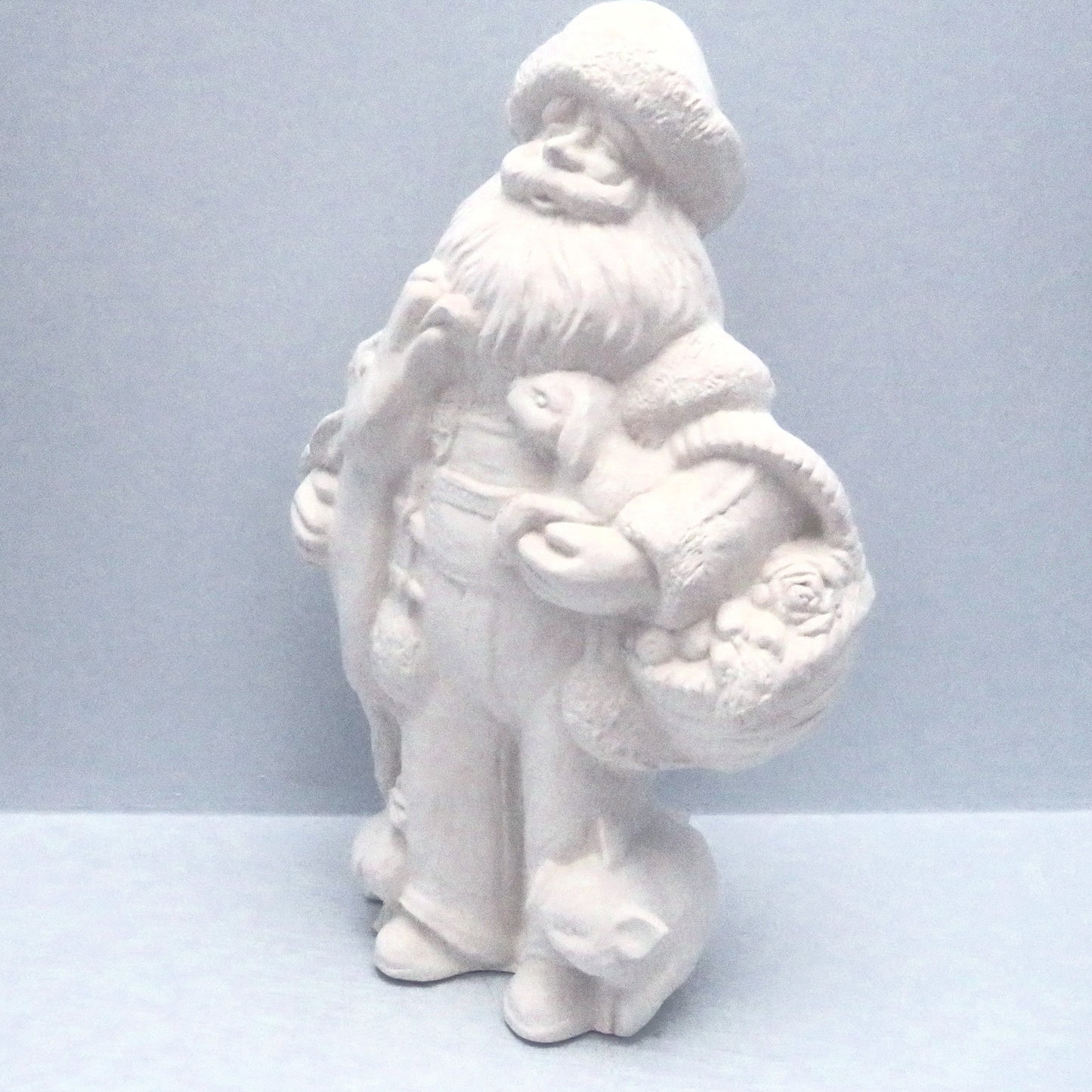 Angeled view of ready to paint farmer santa figurine