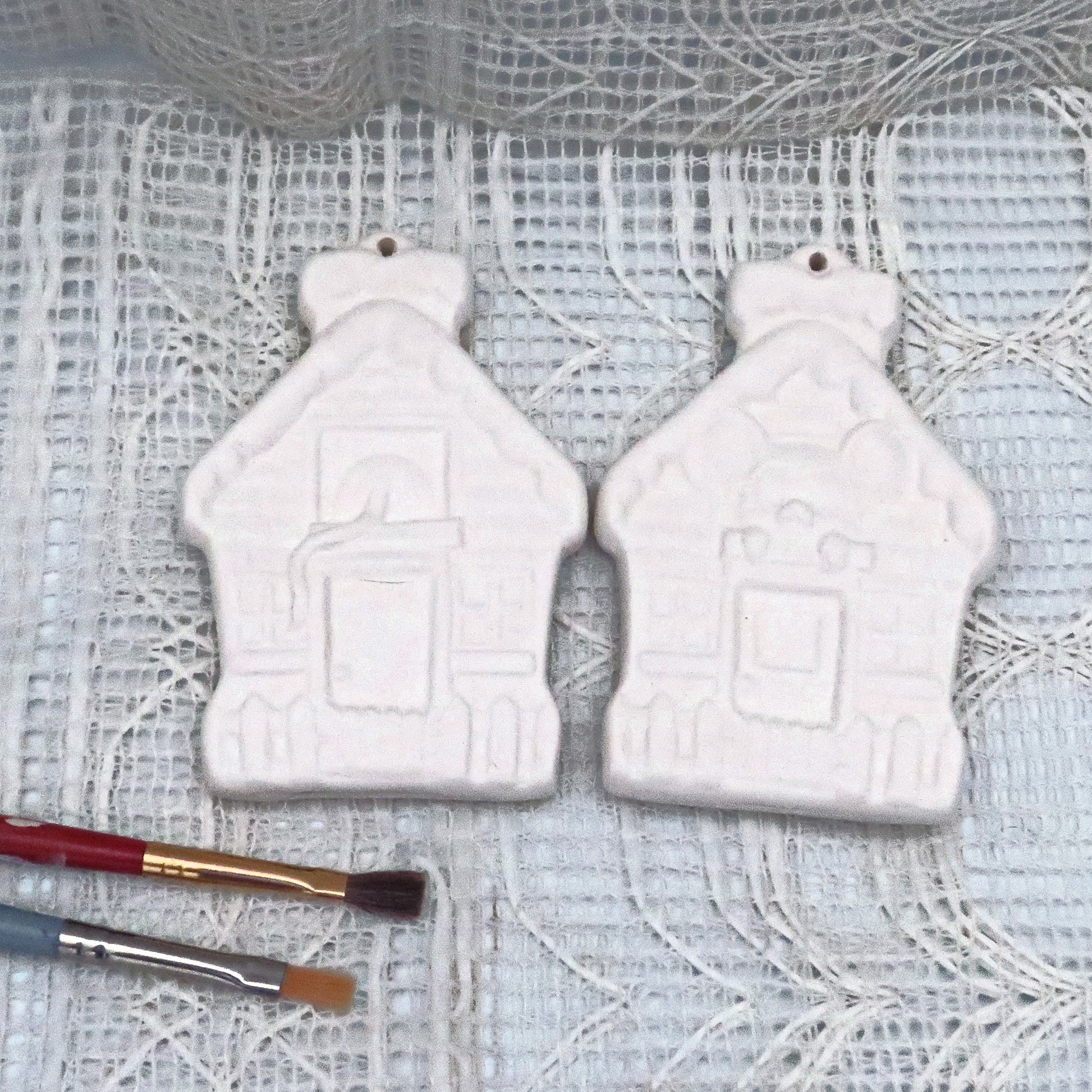 Handmade Ready to paint ceramic Christmas Tree ornaments in gingerbread house shape with a mouse peaking out above the door and his back side and tail out the back window.  