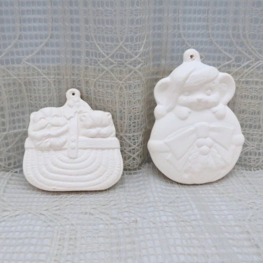 Ready to paint ceramic Christmas tree ornaments.  One is 2 little cats in a basket.  The other is a mouse with a hat on holding on to an ornament.