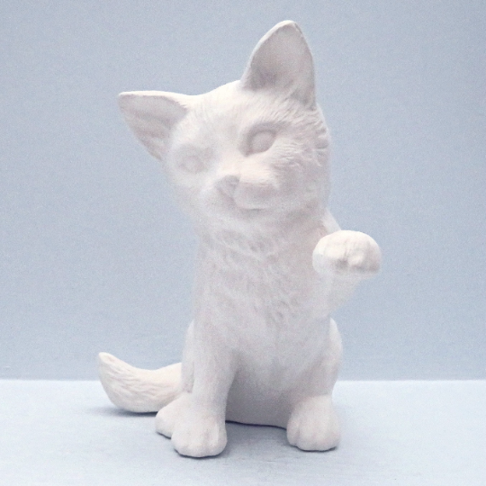 front view of ready to paint ceramic cat figurine with left paw up