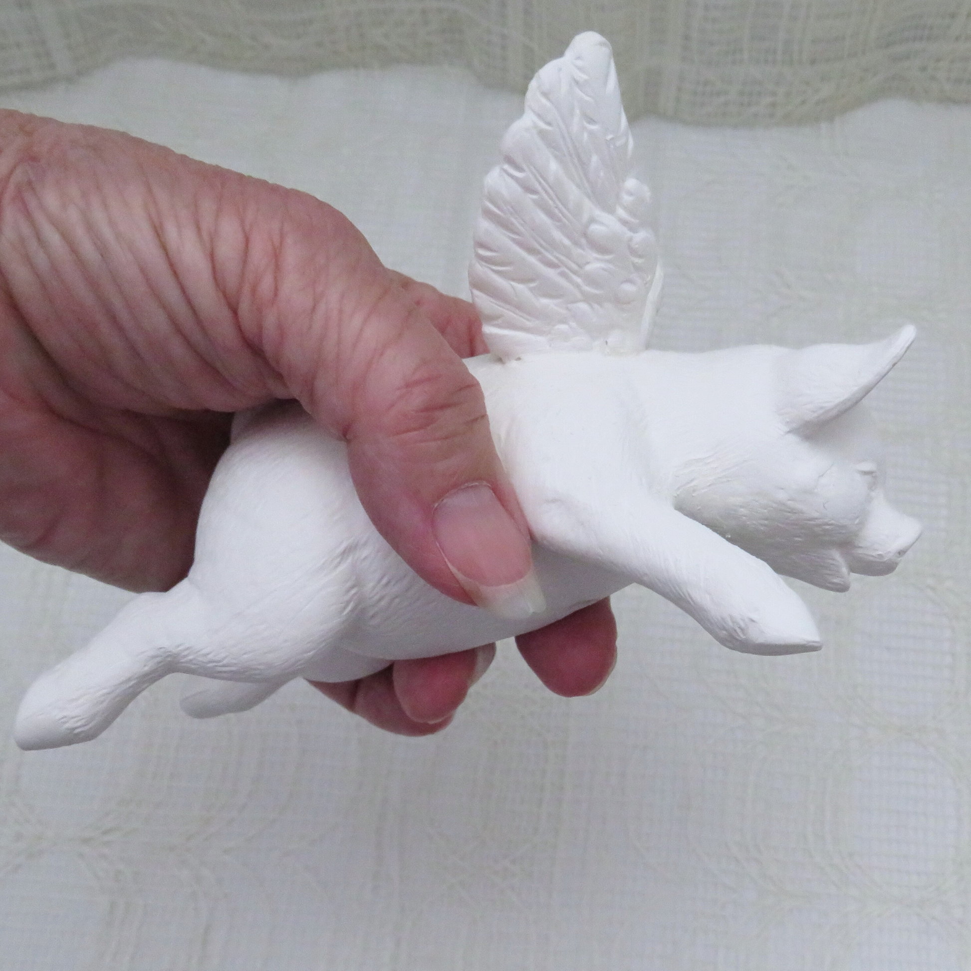 Handmde ready to paint ceramic pig angel in my hand to demonstrate size.