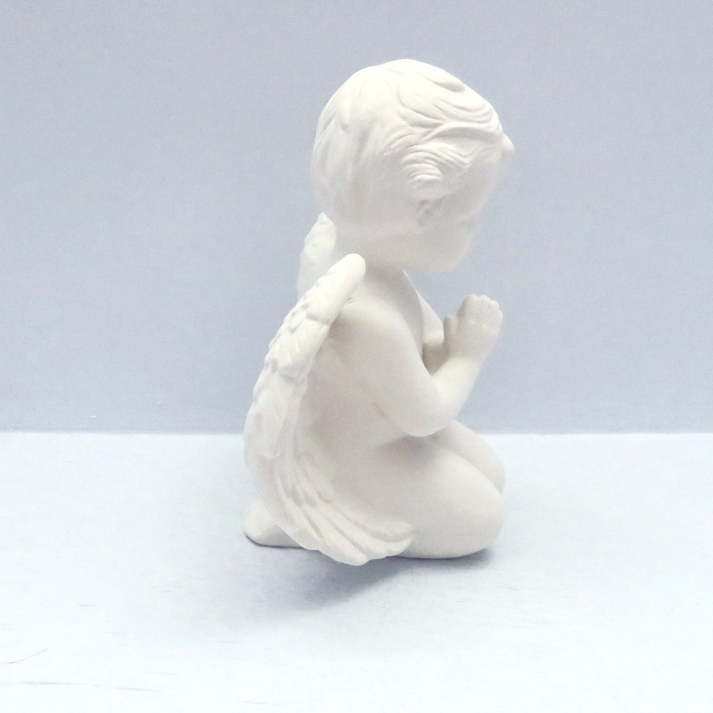 handmade paintable ceramic angel statue kneeling with head bowed and hands folded- side position