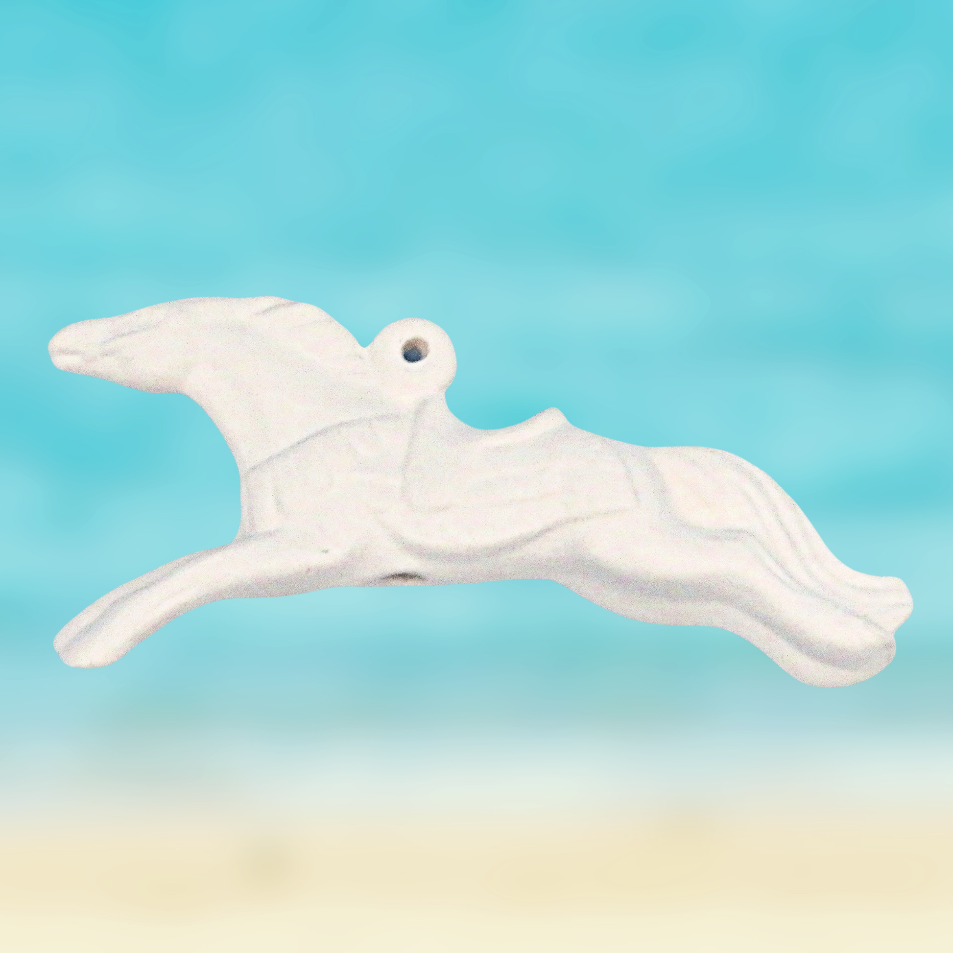 Ready to paint ceramic horse figurine in a leeping position against an ocean aqua background