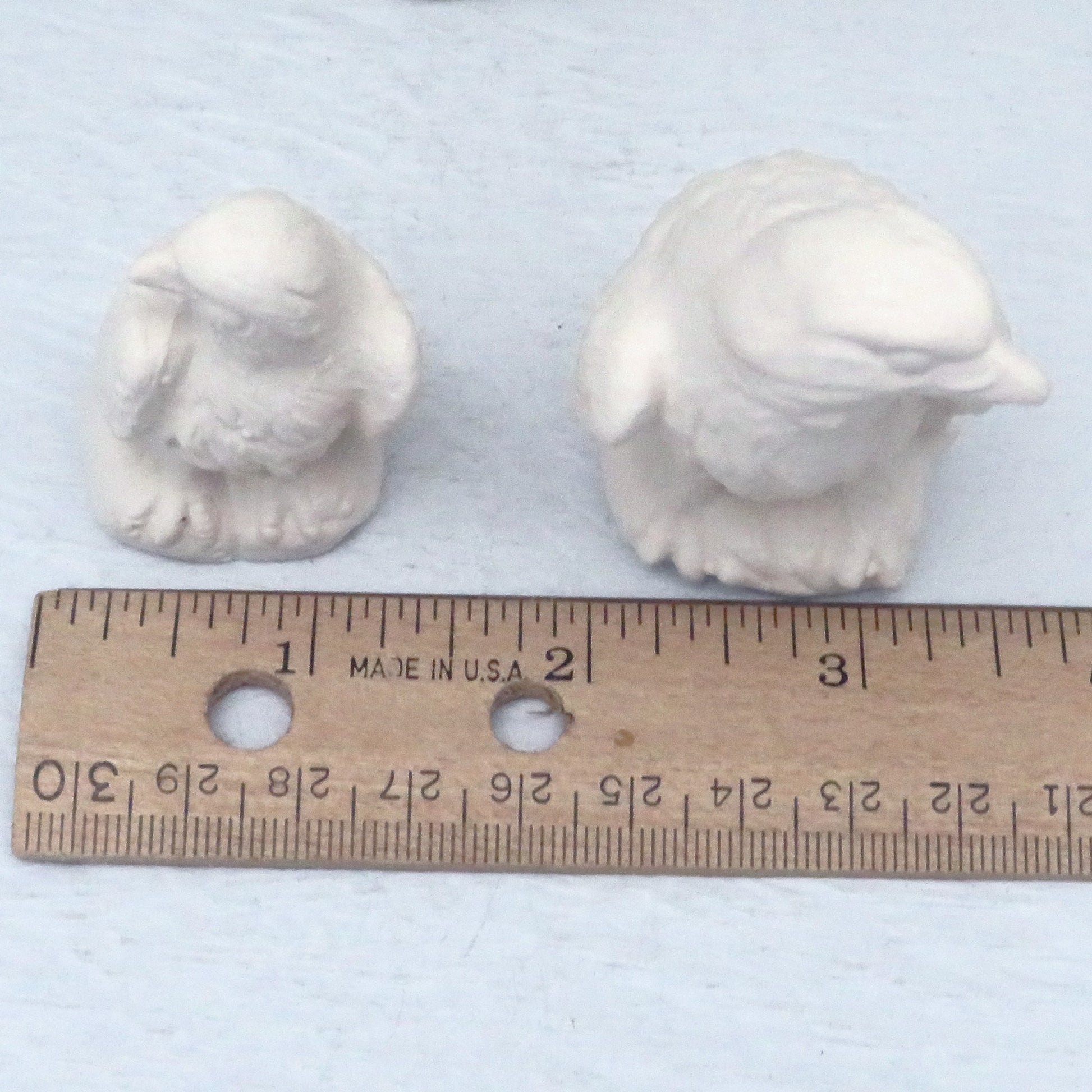 top view of paintable ceramic eagle figurines showing width