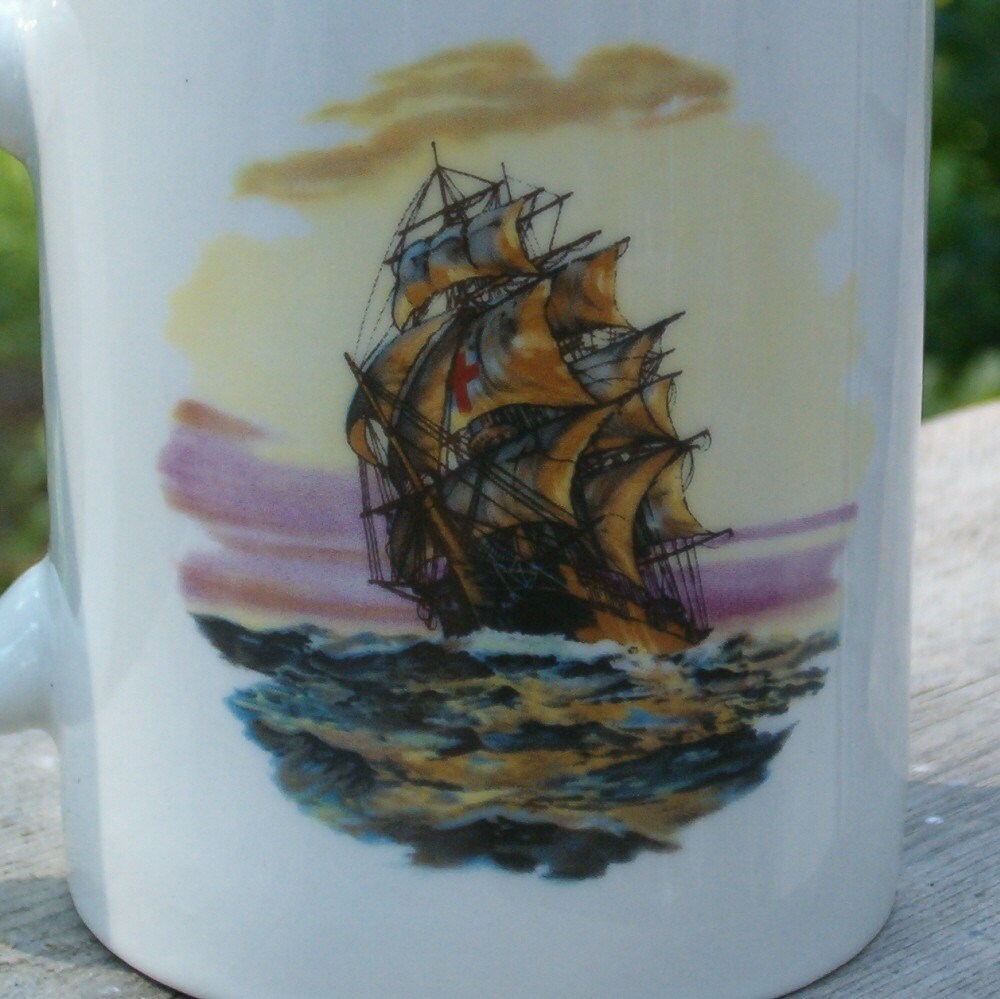 Close up view of the picture on the mug.  It's a clipper ship sailing on the ocean with sunset skies.