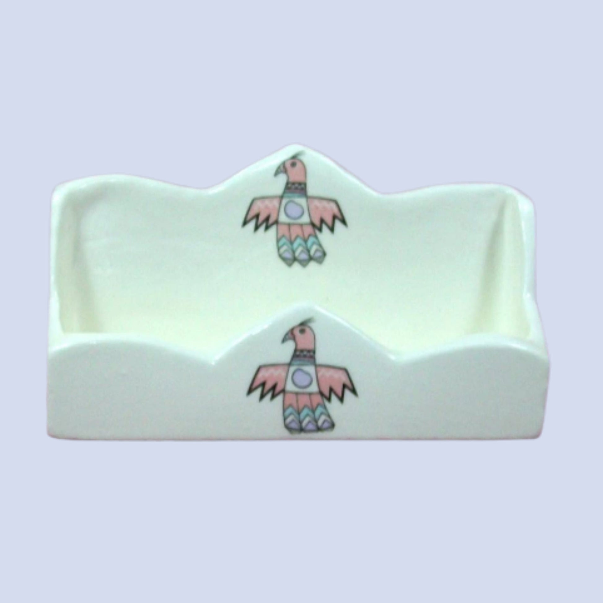 White ceramic business card holder with thunderbirds on the front center and the back front center section